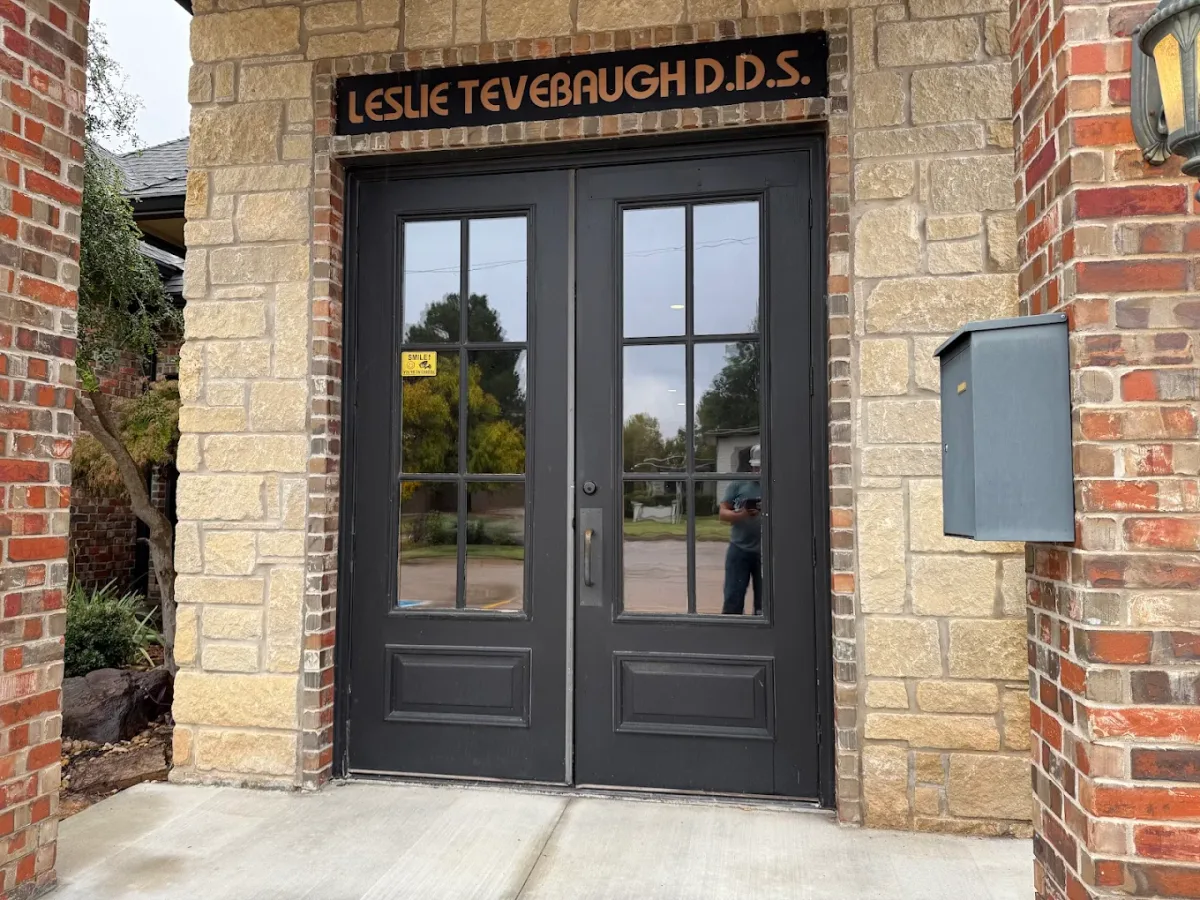 Commercial office entrance with tinted glass double doors, a job by EHCO in Northwest Arkansas