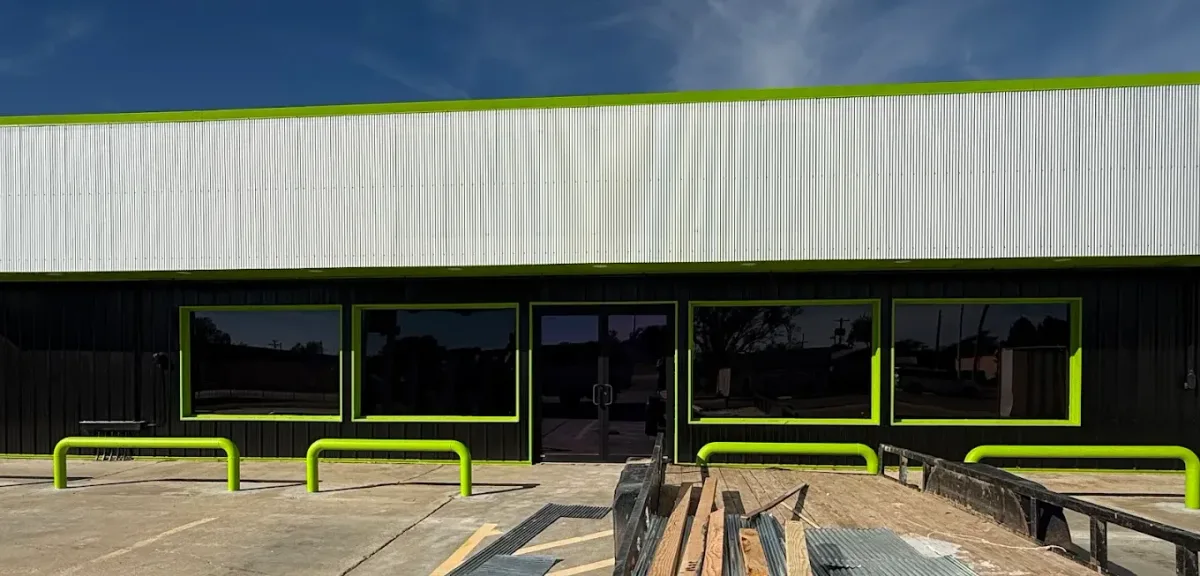 Commercial storefront with dark tinted windows across the front, tinted by EHCO in Northwest Arkansas