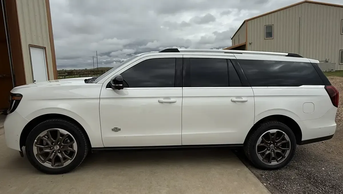 White Ford Expedition with dark window tint installed by EHCO