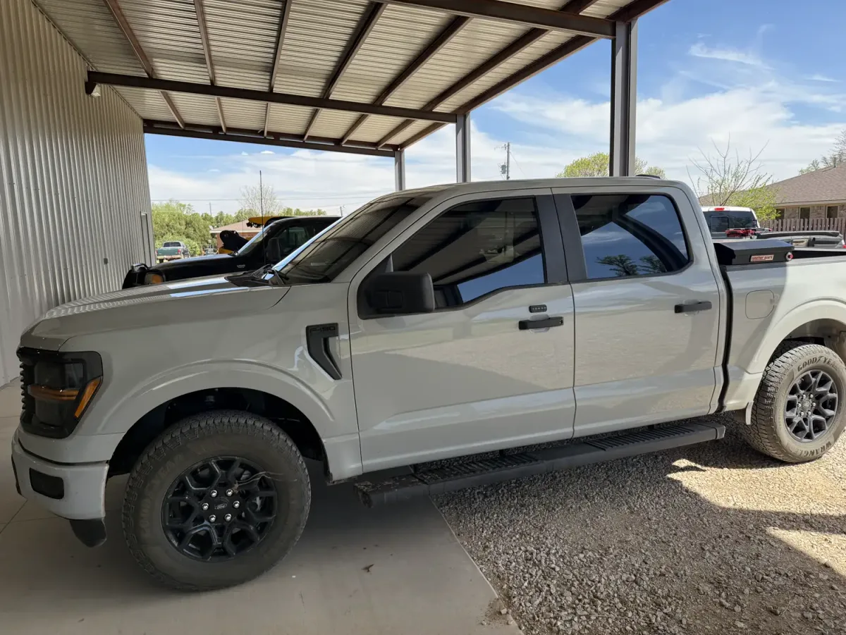 Ford F-150 crew cab with dark window tint on the side and rear glass, tinted by EHCO