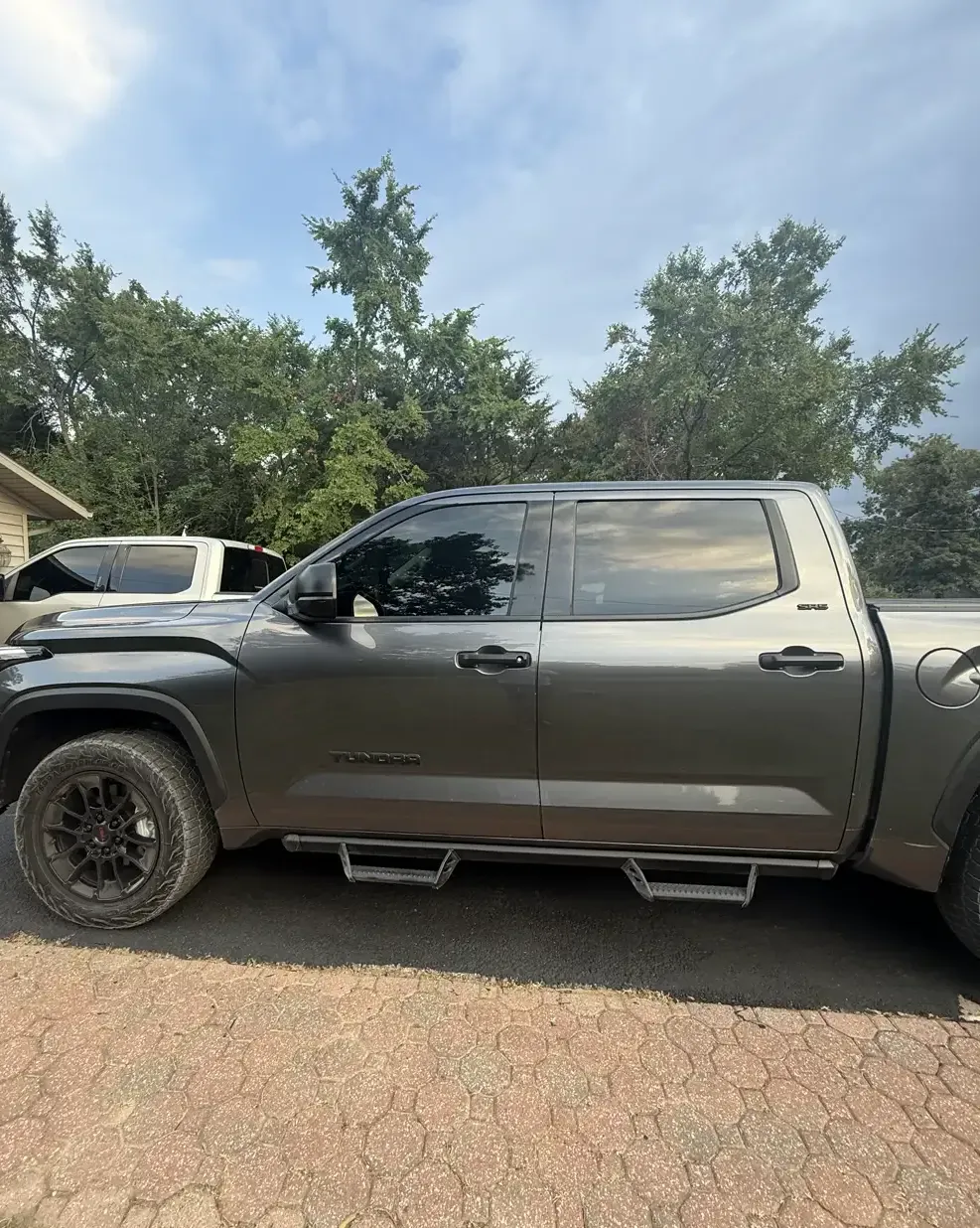 Toyota Tundra crew cab in profile with dark, even tint across all four cab windows